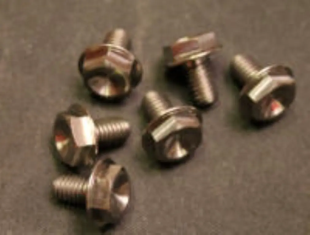 A group of 2011-2018 Polaris Starter Recoil Pulley Bolts on a black surface.