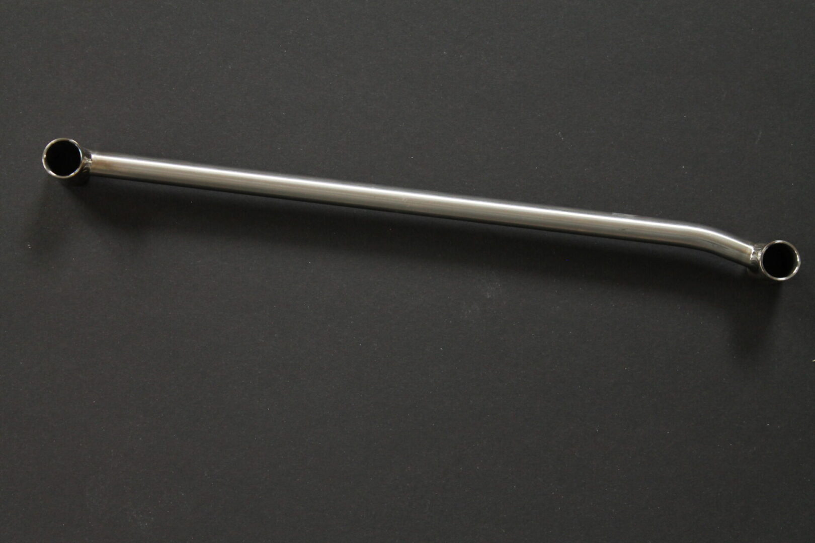 A 16-23 Pro Titanium Shock Rod w/ HCT Coated Alum. Bushings on a black surface.