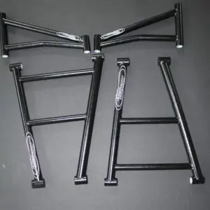 A set of black and white M-Chassis 36.5” Cro-moly/Docol A-Arm Kit suspension parts.