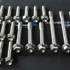 A group of Polaris 850 Cylinder and Head Bolt Kit on a black surface.