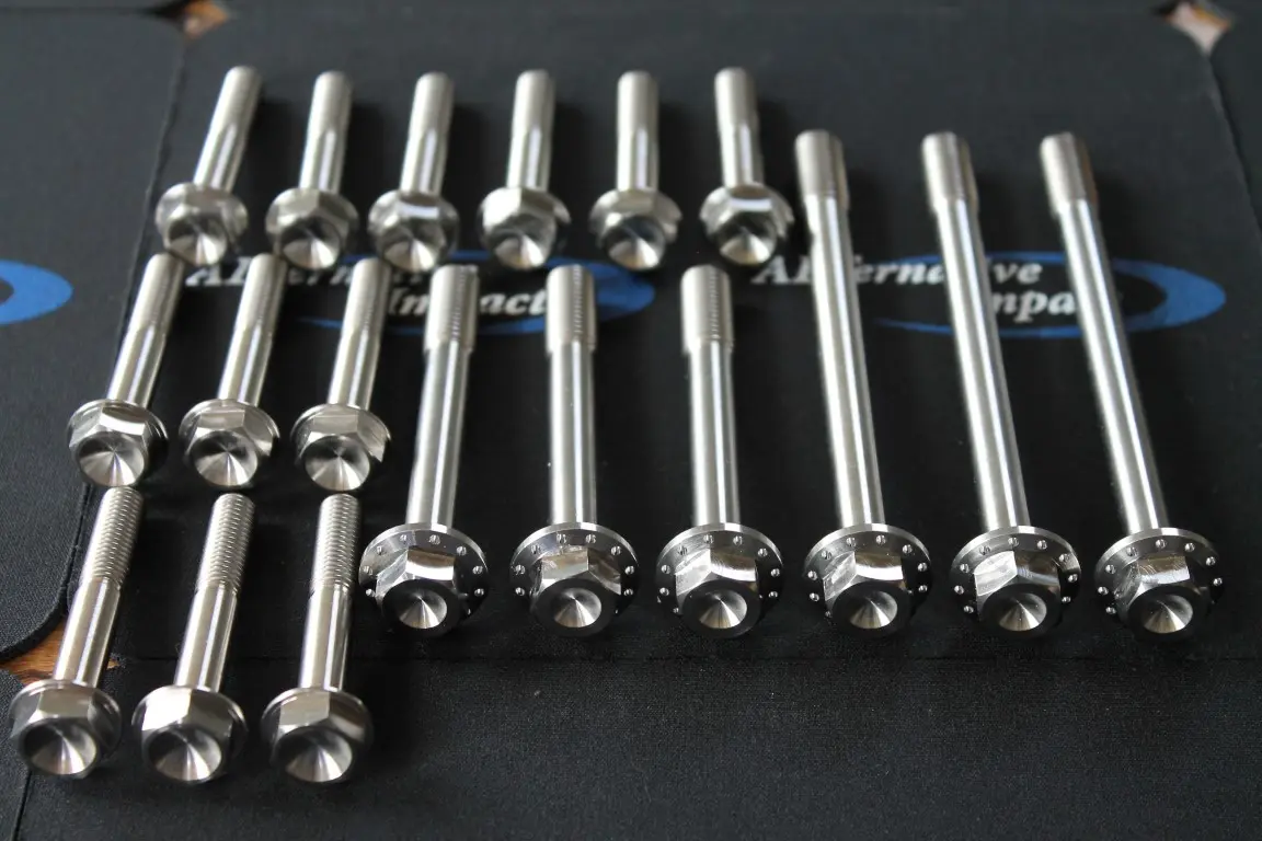 A group of Polaris 850 Cylinder and Head Bolt Kit on a black surface.