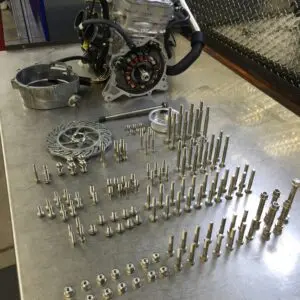 A 2011-2024 Polaris Pro and Axys 800 138 Piece Engine Bolt Kit with screws and bolts on a table.