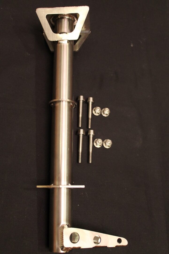 A 11-15 Pro Titanium Steering Post w/ Titanium Bar Clamp Fasteners bracket with screws and bolts.