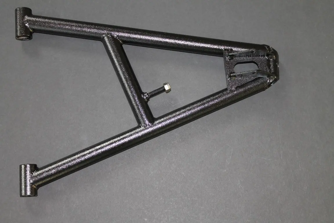 An image of a metal frame on a gray surface.